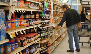 man shopping in a grocery store aisle
