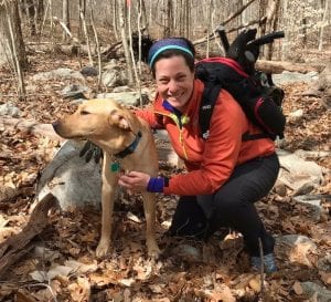 Kim Bradley and a canine companion on the trail