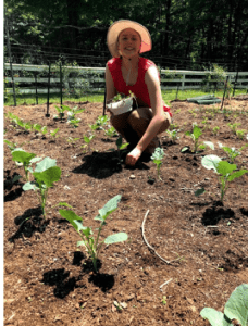 Fairfield County 4-H member in garden during the summer