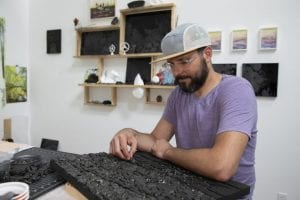 Joseph Smolinski works on a sea coal mosaic in his New Haven studio. Photo: Jessica Smolinski