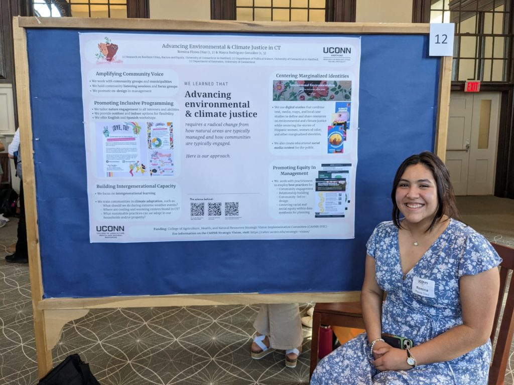 Woman smiling with a research poster in the background
