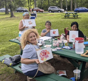 group of women at a picnic table