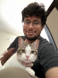 Moazzam Sultan holding a cat