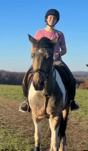 women riding horse outside