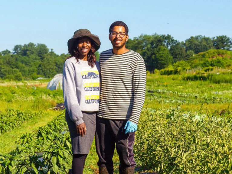 couple standing in their farm field