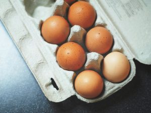 brown eggs in a grey carton