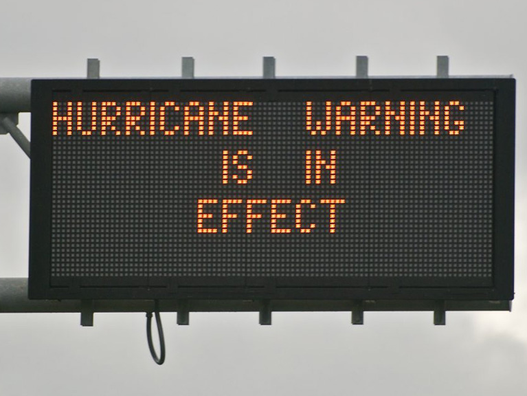 hurricane warning road sign