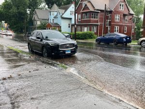 storm water flowing down urban street