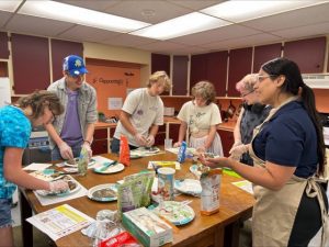 Dianisi Torres leading a cooking class in Willimantic