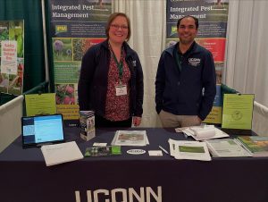 Sydney Everhart and Srikanth Kodati at a UConn Extension table